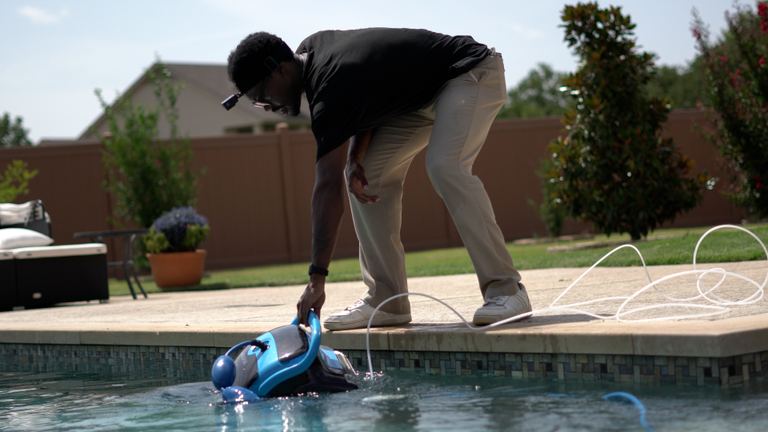 Dolphin Nautilus CC Plus Lowering Robot Into Pool By Handle