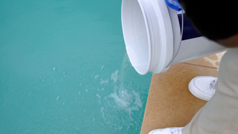 Pool Maintenance Emptying Bucket Into Pool Second Angle