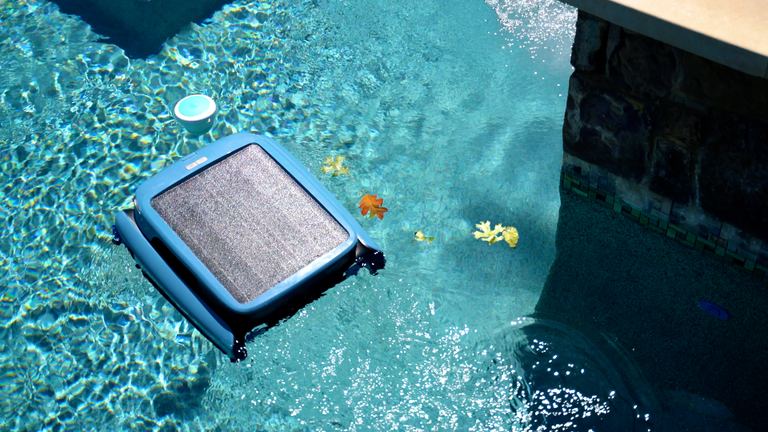 Beatbot Iskim Ultra Floating Near Pool Edge Leaves Visible
