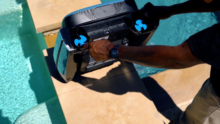 Beatbot Iskim Ultra Holding Robot Near Pool Edge Fans