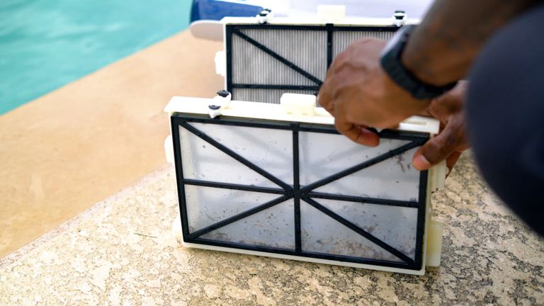 Dolphin Sigma Hand Holding Fine Filter Panel Close Up