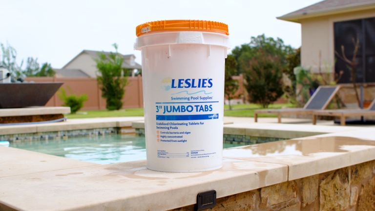 Leslies 3 Inch Jumbo Tabs Bucket With Orange Lid Standing On Coping