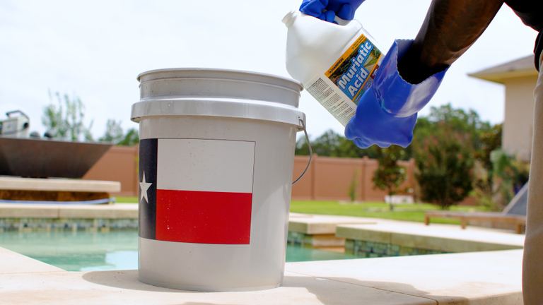 Champion Muriatic Acid Tilting Jug Over White Bucket
